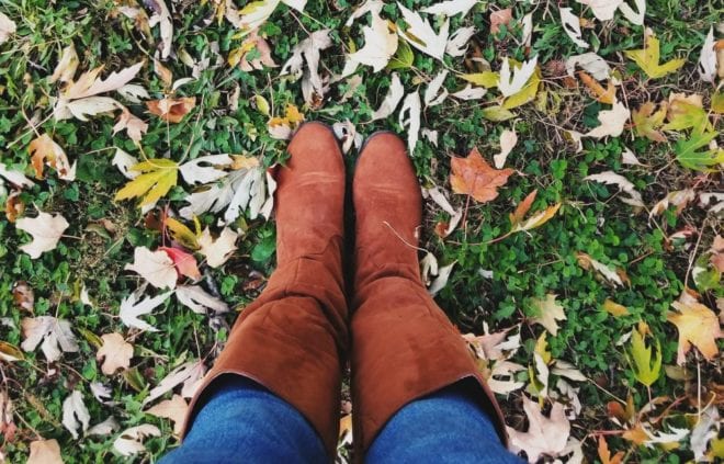 Girl in Boots Standing on Fall Lawn